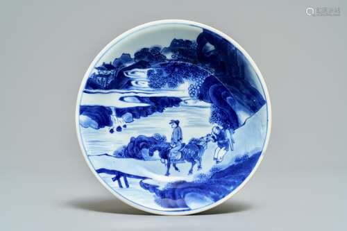 A Chinese blue and white plate with travellers in a landscape, Kangxi mark and of the period