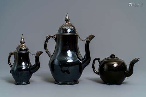 Two silver-mounted Namur black-glazed pottery jugs and a teapot, 18th C.