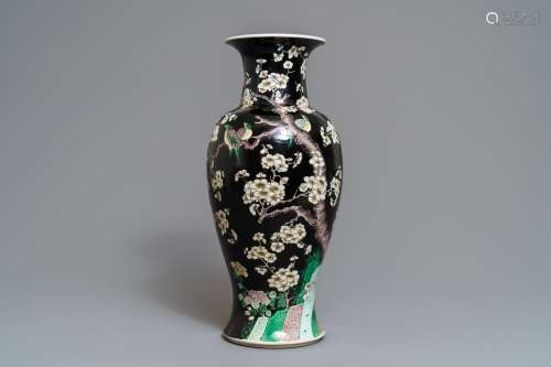 A Chinese famille noire 'magpie and prunus' vase, Kangxi