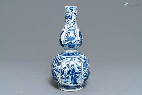 A Dutch Delft blue and white chinoiserie double gourd vase, early 18th C.