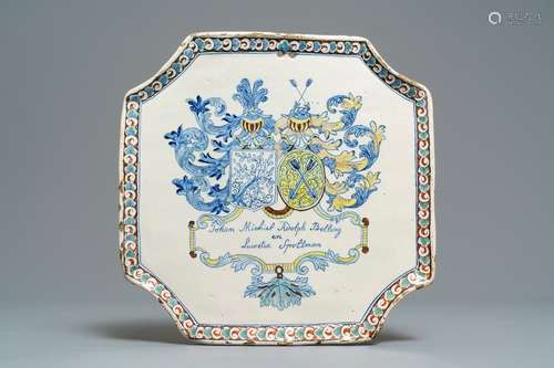 A Dutch Delft polychrome armorial marriage plaque, ca. 1704