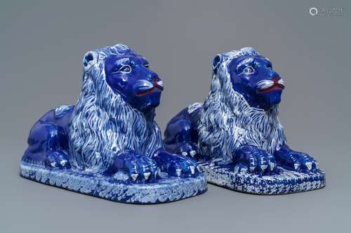 A pair of blue-ground models of recumbent lions, Luneville, France, late 18th C.