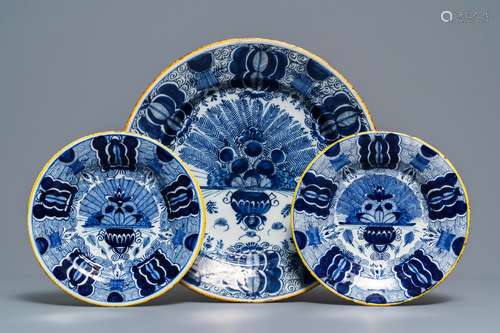 A Dutch Delft blue and white 'peacock's tail' dish and a pair of plates, 18th C.