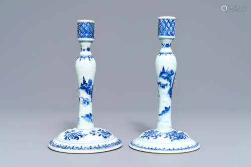 A pair of Chinese blue and white candlesticks, Kangxi/Qianlong