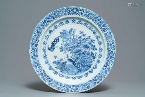 An exceptionally fine large Dutch Delft blue and white 'peacock and flowers' dish, 17th C.