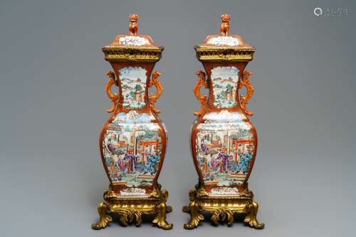 A pair of large Chinese ormolu-mounted famille rose 'mandarin' vases and covers, Qianlong