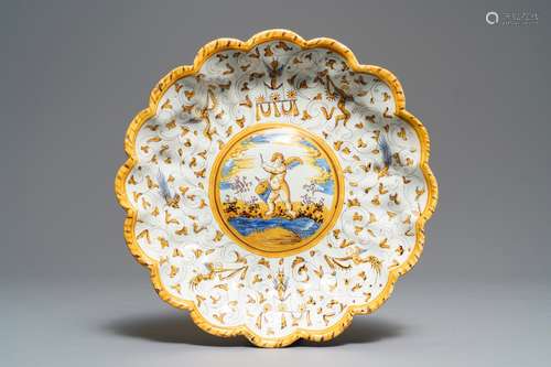 A lobed Dutch maiolica dish on foot with a putto surrounded by grotesques, Willem Jansz Verstraeten, Haarlem, ca. 1650