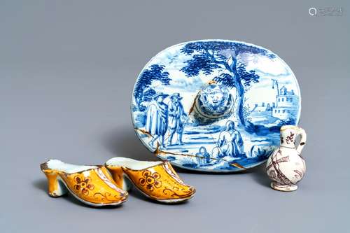 A pair of Dutch Delft polychrome slippers, a miniature jug and a fine lid, 18th C.