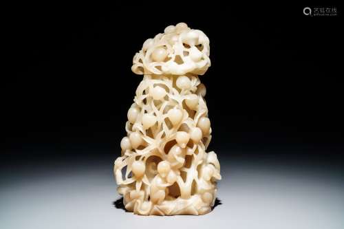 A Chinese pale brownish white jade vase with monkeys in a peach tree, 19th C.