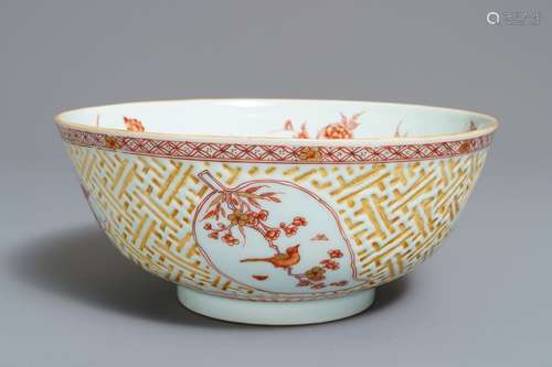 A Chinese iron red and gilt relief-decorated bowl, Kangxi