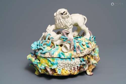 A large and impressive Brussels faience tureen with a lion fighting a dog, 1st half 18th C.