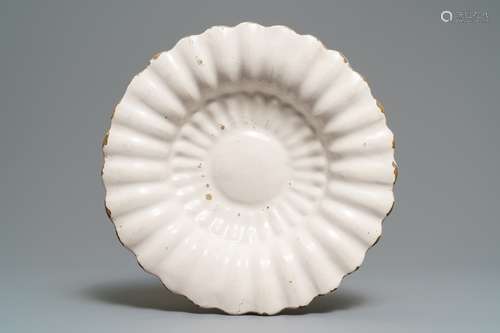 A white Dutch Delft gadrooned dish, 17th C.