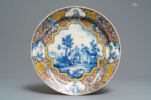 A Dutch Delft polychrome mixed technique romantic scene dish, 18th C.