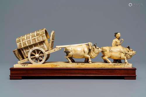 A Chinese carved ivory group of a farmer with buffalo chariot, ca. 1900