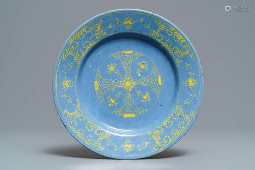 A rare Dutch Delft yellow on berettino-ground plate, 18th C.