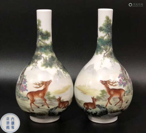 A PAIR OF PORCELAIN SURROUNDED LANDSCAPE PATTERN VASES