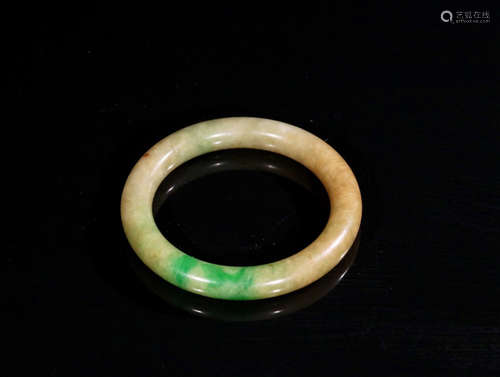 AN OLD JADEITE BANGLE