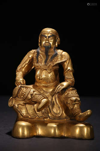 A BRONZE BUDDHA OF GUAN YU GILDED WITH GOLD