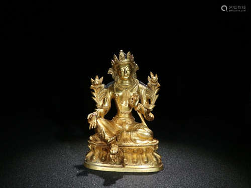 A GILT BRONZE BUDDHA SHAPED ORNAMENT