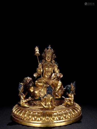 A GILT BRONZE BUDDHA SHAPED ORNAMENT