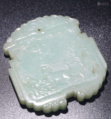 AN OLD JADEITE PENDANT