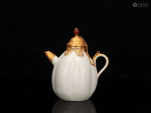 A DING YAO WHITE GLAZED PORELAIN TEAPOT WITH GILT SILVER DECORATED