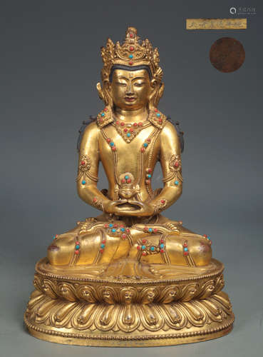 A XUANDE GILT BRONZE SHAPED SITTING BUDDHA