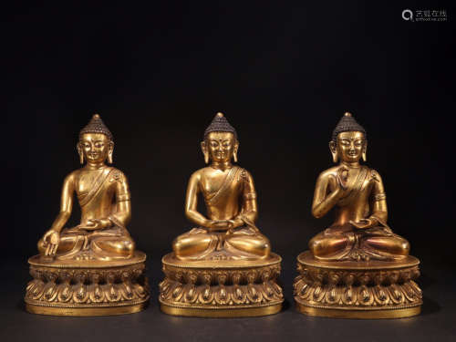 THREE GILT BRONZE BUDDHA ORNAMENTS