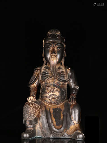 A BRONZE GUANYU SHAPED ORNAMENT