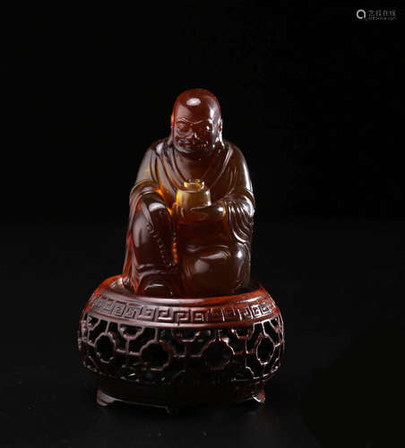 A Chinese Carved Amber Figure of Damo