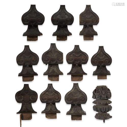 ELEVEN ASSORTED BUT SIMILAR CARVED WOOD ARCHITECTURAL FRAGMENTS