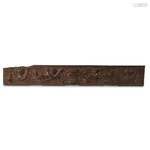 A CARVED WOOD FRIEZE FRAGMENT