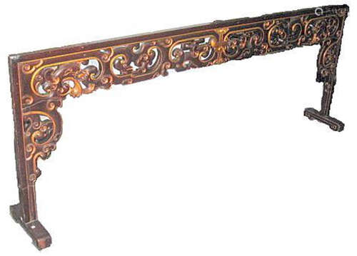 A Chinese carved wooden headboard