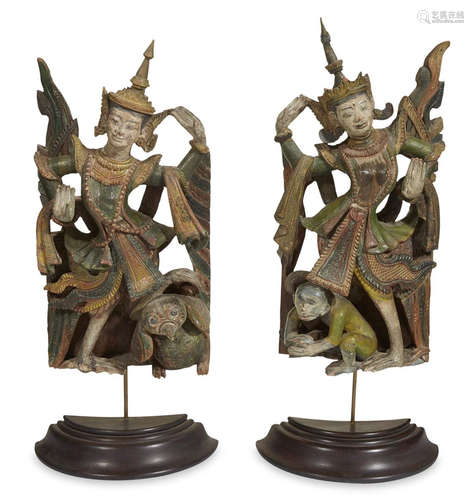 A pair of Burmese carved and painted wood figures of a kinnara and a kinnari