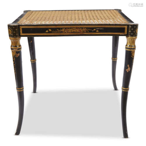A Regency style black and gold painted stool with caned seat
