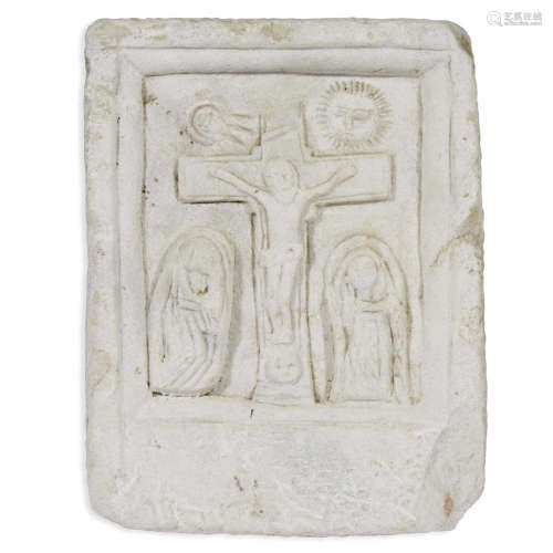 A carved white marble plaque depicting the Women at the Crucifixion