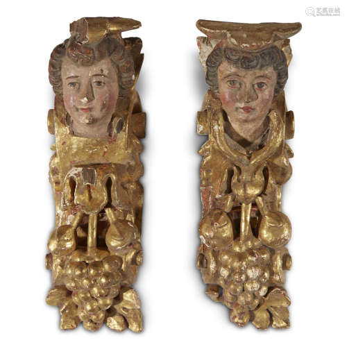 A PAIR OF CONTINENTAL POLYCHROMED GESSO AND GILTWOOD FIGURAL ARCHITECTURAL FRAGMENTS