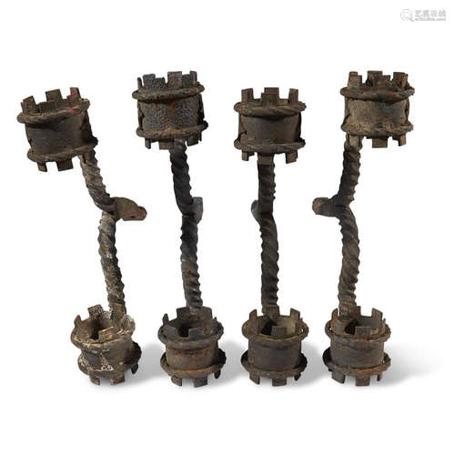 A GROUP OF FOUR WROUGHT IRON SCONCE ARMS