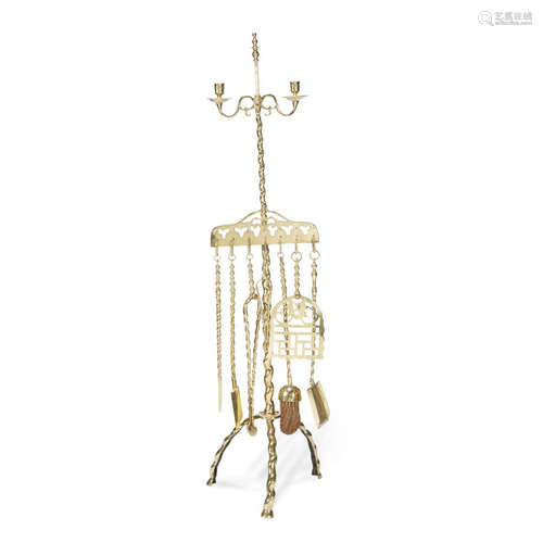 A brass twin light candelabrum with firetools