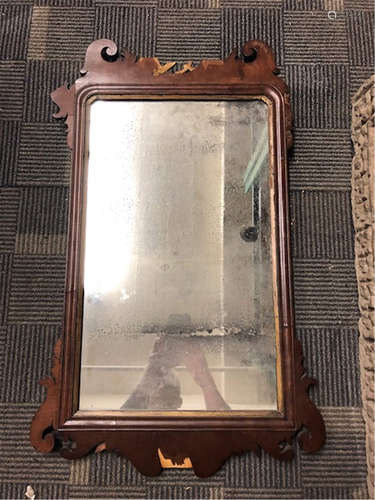 A Chippendale mahogany and parcel-gilt looking glass