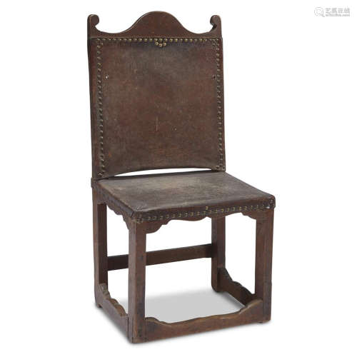 A SPANISH OR ITALIAN WALNUT ARMCHAIR WITH LEATHER UPHOLSTERY