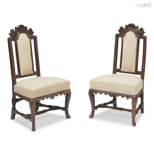 A PAIR OF SPANISH CARVED WALNUT SLIPPER CHAIRS