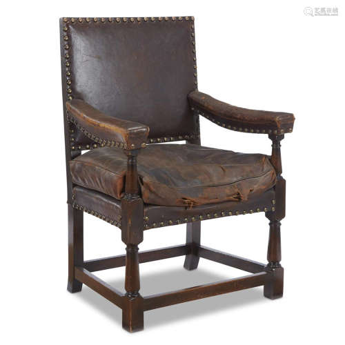 AN ENGLISH OAK LEATHER-UPHOLSTERED LIBRARY CHAIR