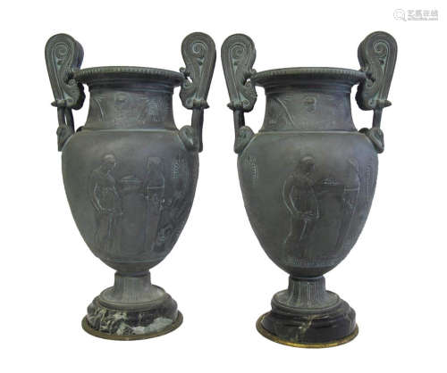 A pair of grand tour patinated spelter urns