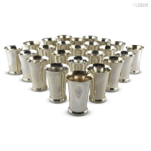 A SET OF TWENTY-FOUR WEIGHTED SILVER TUMBLERS