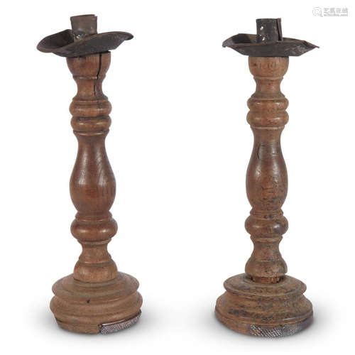 A PAIR OF EARLY TURNED WOOD AND TOLE CONTINENTAL CANDLESTICKS