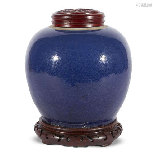 A Chinese dark blue-glazed porcelain ovoid jar with wood stand and cover