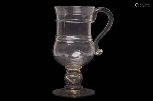 A VERY LARGE GLASS COIN TANKARD