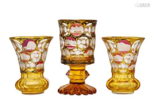 A PAIR OF BOHEMIAN AMBER-STAINED GLASS BEAKERS AND A