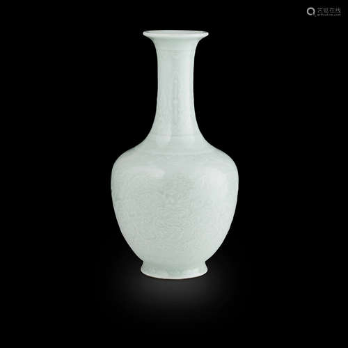 CELADON GLAZED AND CARVED 'PEONY' BOTTLE VASE